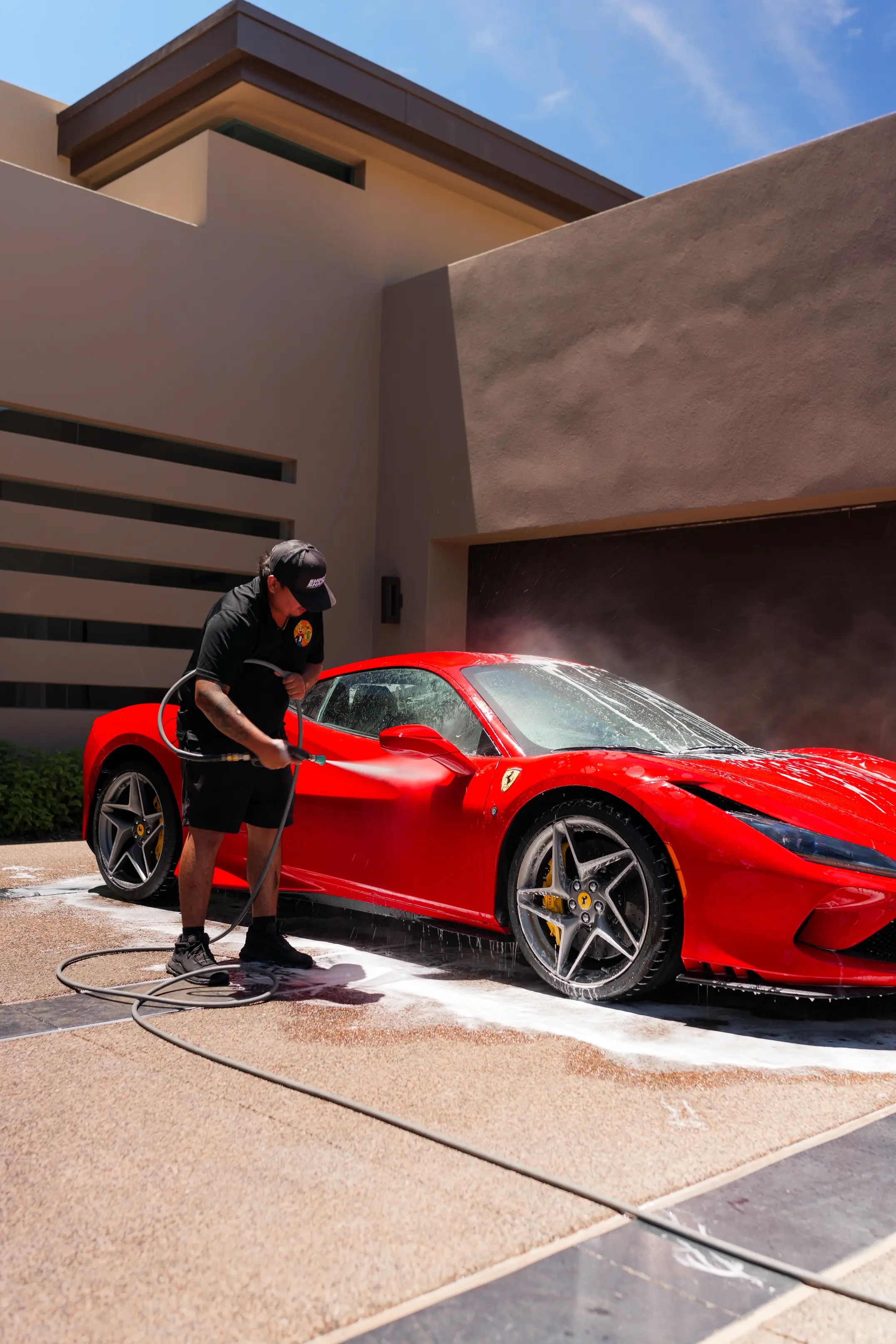 Detailing a sports car at a home in the Valley by Sudz & Shade