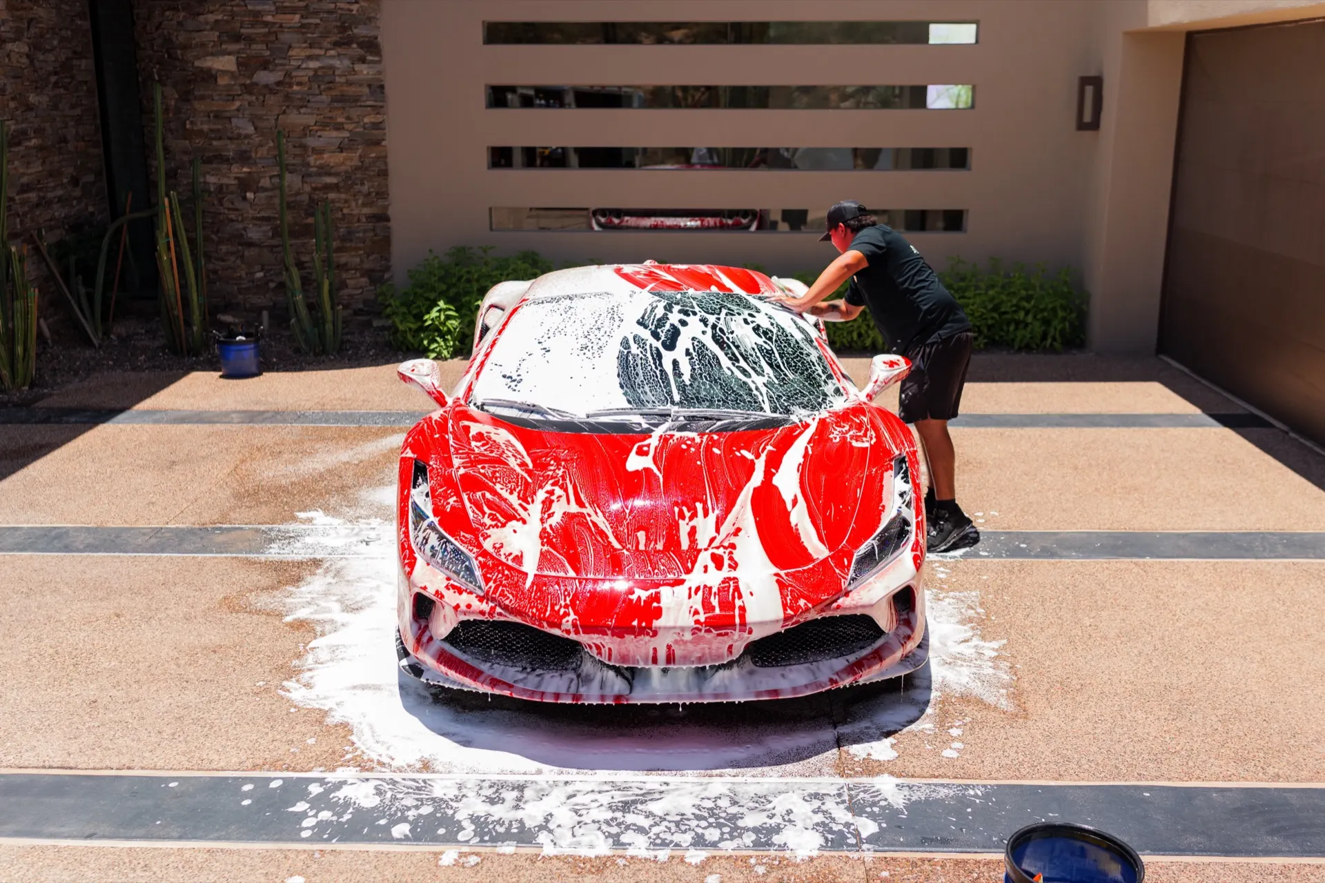 Mobile auto detailing foam wash on a red Ferrari F8 at a home in Scottsdale, Arizona